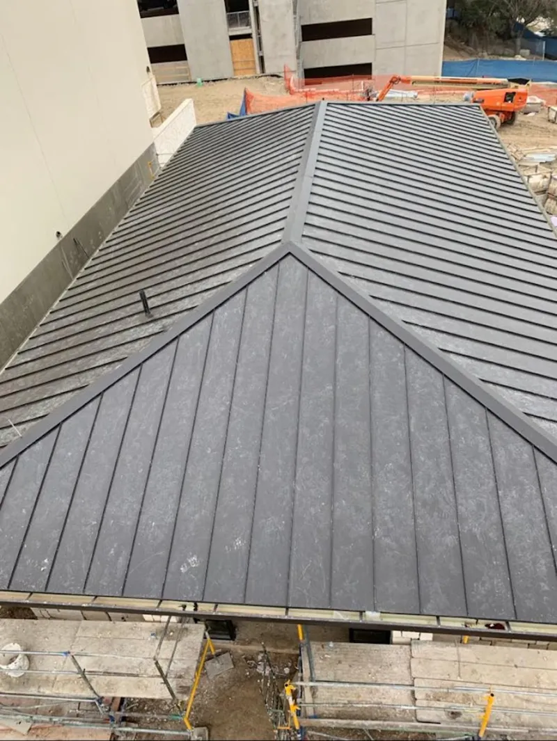 Commercial metal roof construction with crane equipment in Boyes Hot Springs