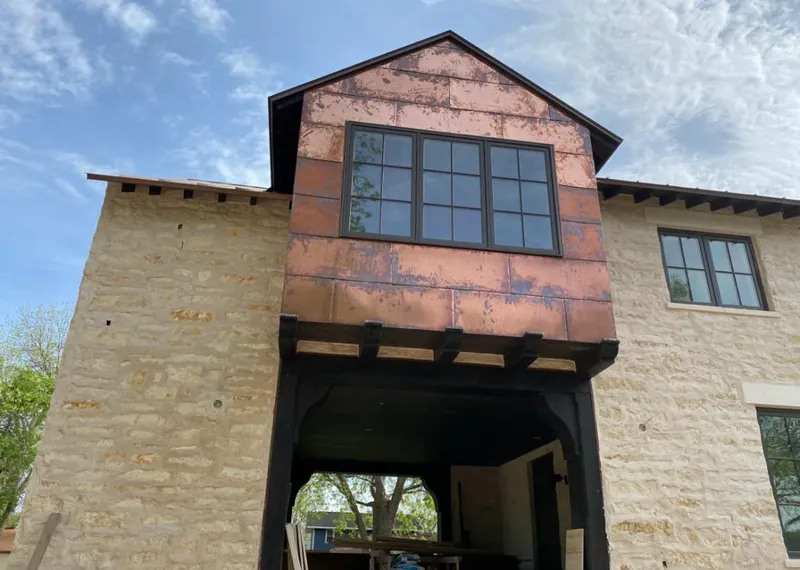 Copper metal panel facade on a stone building for Skylight Installation in Boyes Hot Springs